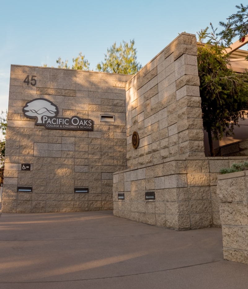 Pacific Oaks College and Children's School logo on stone wall